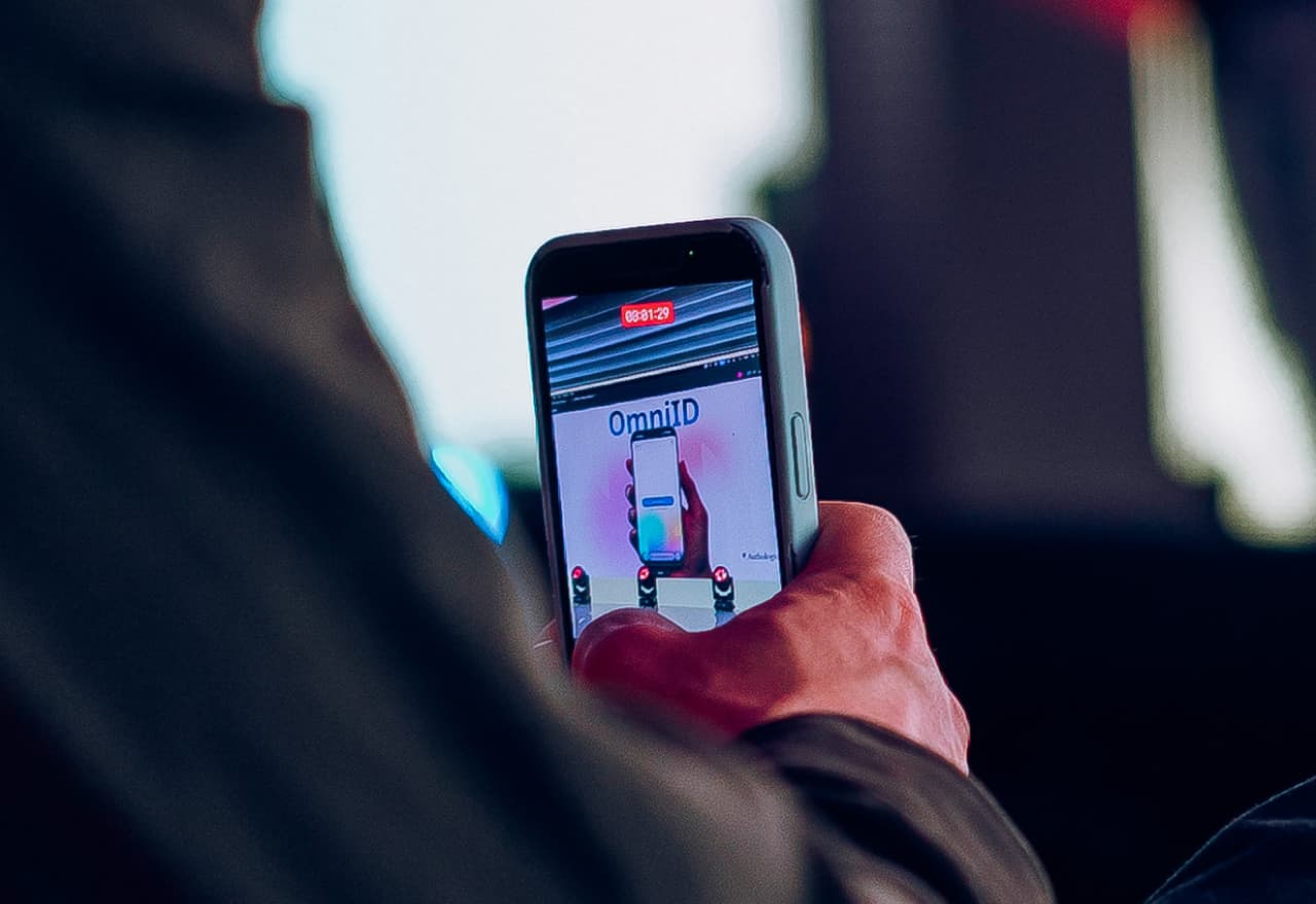 Photo of a phone taking a photo at OmniSummit